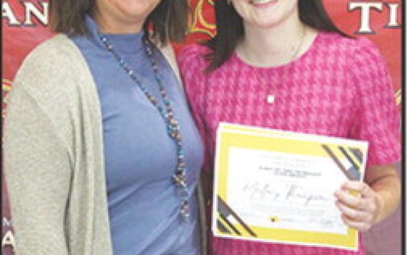 Mallory Thompson received the Columbus Community Foundation 1986 Friendship Scholarship in the amount of $500 at the Senior Assembly, May 16, in the Columbus Unified High School Gymnasium. Mallory also received the Charles and Jane Maxwell Memorial Columbus Community Foundation Scholarship in the amount of $1,000. Kelly Walters, USD 493 Title 1 Reading Specialist made the presentations.