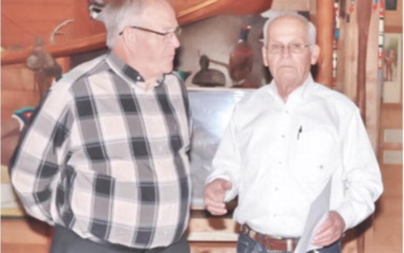 Retired manager of Big Brutus park and museum Joe Manns was presented with the coveted Miner’s Award at the corporations recent annual meeting held at Rowden’s Rustic Moose Lodge in Columbus. The award was presented by Big Brutus Board President Jim Lovell. Photo by Emmett Sullivan.