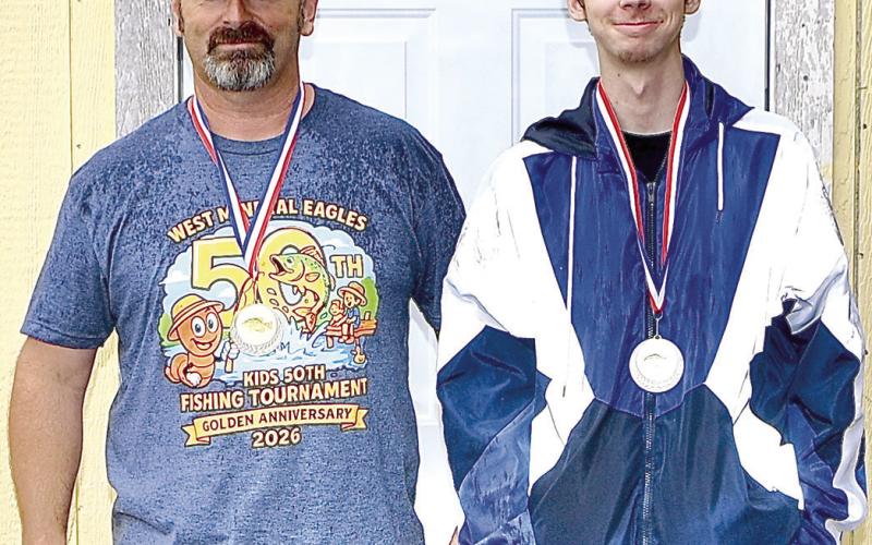 Chris Perry placed first in the adult crappie divison with a weight of 1.08 pounds. John Perry was a close second with 1.06 pounds. Not pictured Zane Grey placed third with .71 pounds. Courtesy photo.