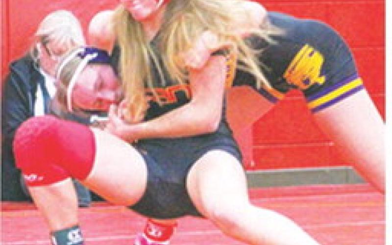 Lady Titan Sophomore, Cara Altis, swept her five matches during the Columbus Duals Tournament Friday Night at the Columbus High School Gymnasium. Cara collected four wins by pin and one in a 5-1 decision against a tough Coffeyville opponent in the 125-weight class. Columbus will travel to Pittsburg for their first matches following the Christmas Break.
