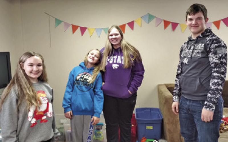 Amory Neely, Allison Brown, Emma and Brooks Walker, all members of Glittering Stones 4-H Club recently volunteered at the Foster Closet. Courtesy photo.