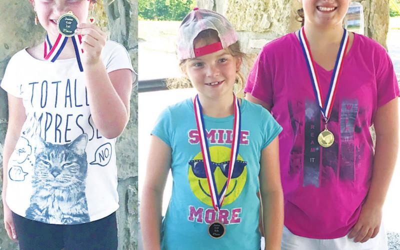 Three Smiley Sisters earned three medals, two first place and one fourth at the SEK Junior Golf Tournament in Coffeyville, Tuesday. Alaina placed first in the 7-8 year-old girls division. Lyndee placed fourth behind Fallon who was the top medalist in the girl’s 9-11 age division. Courtesy Photos.