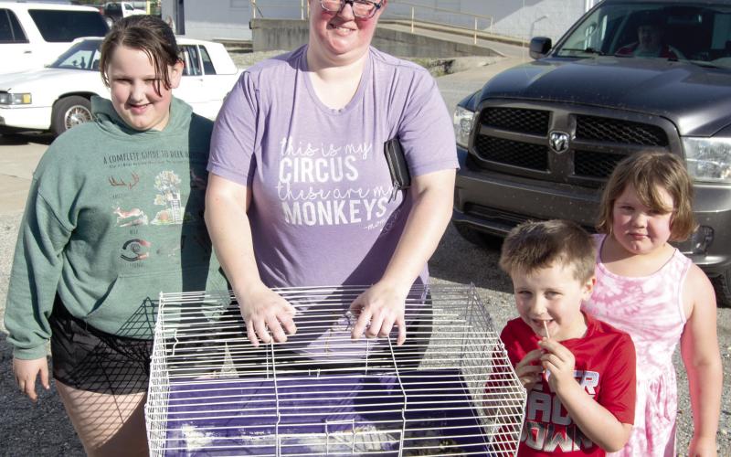 Chick Day at Columbus Farmer’s Coop drew a large interest in buying baby chicks. With their purchases Ema Reynolds, Angela Aldrighetti, Donny and Ellis Reynolds. There were 12 different breeds of chicks available.