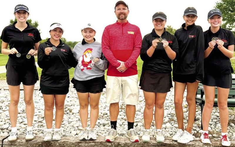 The 2025 CNC League Champions, Columbus Lady Titan Golf Team. Natalie Wary, junior; Hannah Noel, junior; Amory Neely, junior; Head Coach Jerry Smiley; Fallon Smilely, freshman; Addison Johnson, freshman; and Cali Carpino, freshman. Courtesy photo.