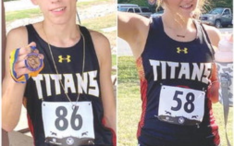 Titan sophomore, Gage Witham, placed sixth and Lady Titan Sophomore, Kenadie Carter, placed 14th to earn medals in the Girard Cross Country Meet at Greenbush. September 15. The Columbus Team was at Southeast yesterday and are scheduled to race at Rim Rock in Lawrence tomorrow. Courtesy Photos.