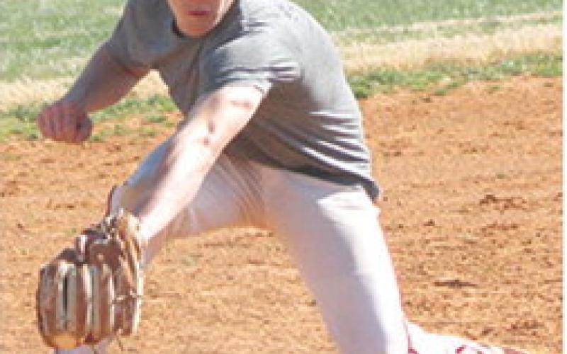 Shade Schuberger, Titan Junior, makes a snag at third base during a morning practice, Wednesday, at Bomber Field. The Titans play Vinita, Okla. today at 2:30 p.m. in the Wyandotte, Okla. Baseball Festival. They take on Dibble tomorrow at 12:15 p.m. in Seneca, Mo.