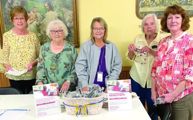 At the May 15 meeting of Cherokee County Retired School Personnel meeting, Becky Mogle, (center) from the Health Department spoke to the group about healthy eating and the various nutrition programs available locally. Pat Spriggs, Marilyn Wheatley, Mogle, Marva Holt and Rebecca Logan look over some of the literature and brochures.