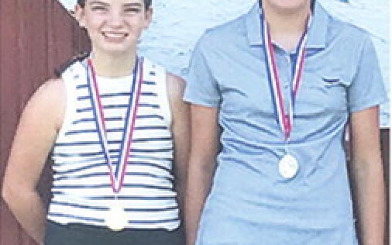 Alaina Smiley placed first and Cami Carpino finished second in 9-11 girls division of the SEK Junior Golf League opener, Tuesday, at Oswego.