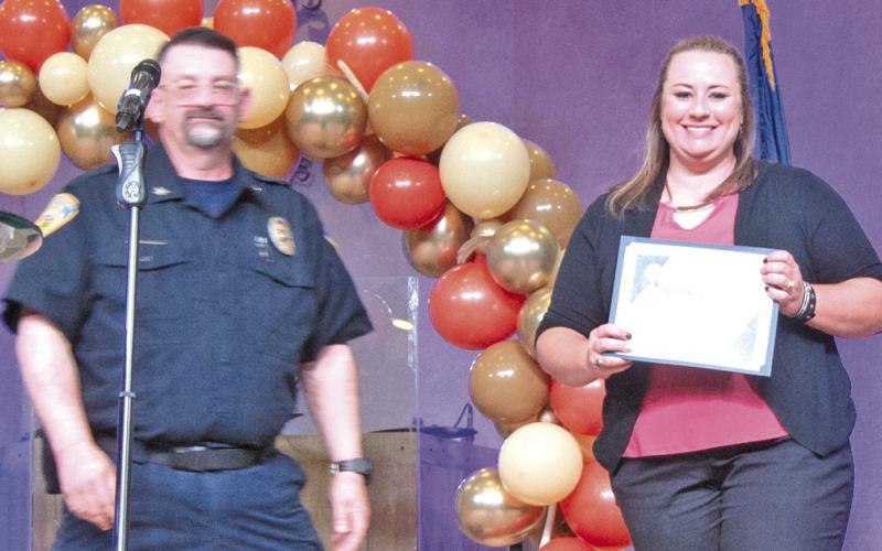 Baxter Springs Police Chief Jimmy Hamilton presented Rhanda Andrews with the Meritorious Service award.