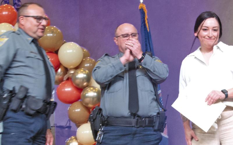 Sheriff Brian Henderson and Undersheriff Chip Root presented the Sheriff Deputy of the Year award to Sam Snell.