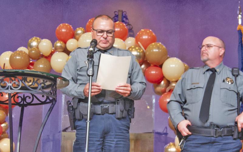 Those receiving the Letter of Excellence award included Deputy Dave Lovewell, Sheriff Brian Henderson presenting the award, Deputy Zack Davis, Those receiving the award but not pictured are Detention Sargent Chaney McDaniel, and Deputy Abby Porter.