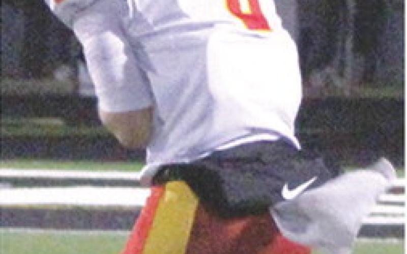 Titan Senior, Jace Midgett, makes the catch and runs to complete a 68-yard pass play for a touchdown from senior quarterback, Jack Vilela, in the Friday night loss, 13-34, at LaCygne-Prairie View in the Kansas Class 3A Regional match up.