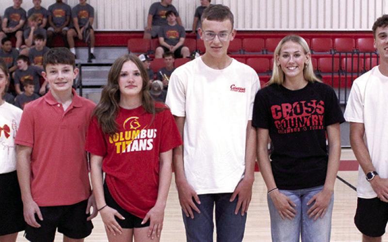 The Columbus 2026 Titan Cross Country Team was introduced during Meet the Titan Night at the CUHS Gymnasium, August 21. Freshmen, Cora Rider and freshman, Tanner Scott, join the team for their rookie campaign. Myah Tash, sophomore; junior, Cooper Grundy; senior Cara Altis, and senior, Levi Simpson will hit the course, Thursday, at Labette County. (Not pictured Drake Laurance, senior.)Races have been changed to two miles for high school and one mile for jr. high beginning at 10 a.m. due to heat forecasts.