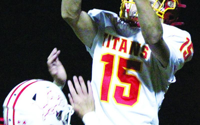 Jonas Stover, Columbus Freshman, makes a catch in the back corner of the end zone for the two-point conversion in the fourth quarter of the Titan loss to the Lions, 16-20, Monday, in Baxter Springs. Freshman quarterback, Cole Howard, connected with Stover for the touchdown leading to the conversion.