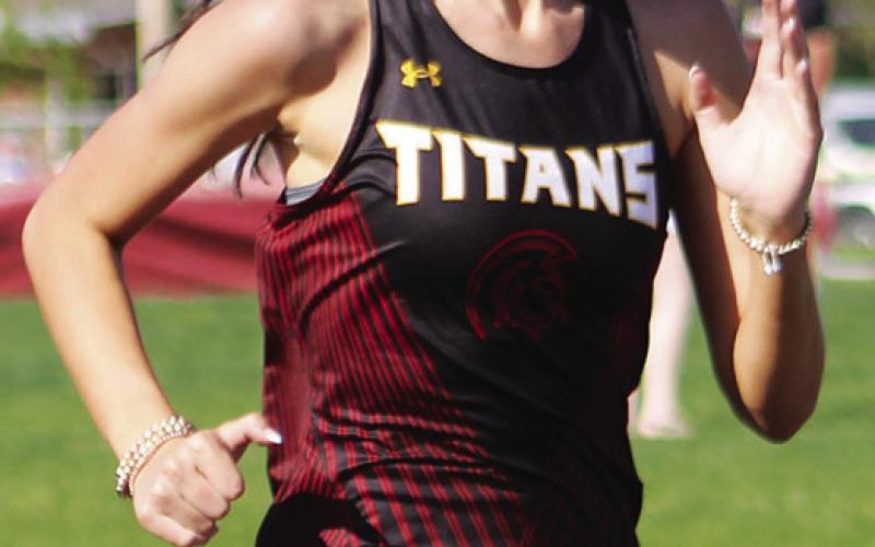 Lady Titan Sophomore, Faith Williams, competed in the 200 Meter Dash after taking first place in the girls Pole Vault event at the Columbus Track and Field Invitational Meet, Tuesday, at the Central School Campus.