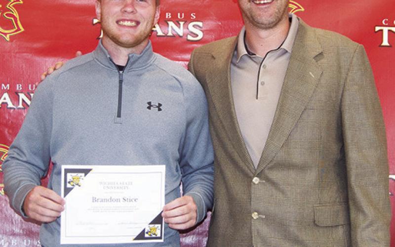 Brandon Stice received three scholarships from Wichita State University during the Columbus Unified High School Senior Assembly, May 16, at the CUHS Gym. He was awarded the Stucky Business Scholarship for $21,256, the Morrison Mer-it Scholarship for $14,000, and the DSI Semi-Finalist Scholarship for $4,000. Matt Crain, USD 493 Instructor, presented the awards.