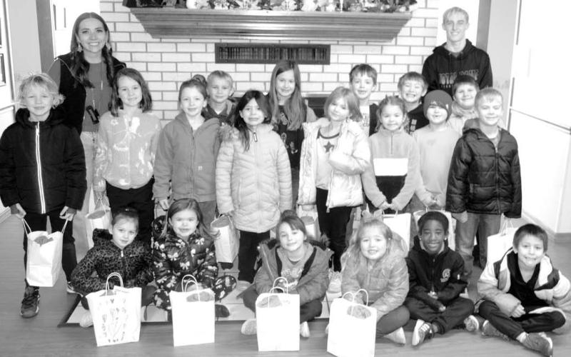 Emily Peterson, with the assistance of Corbyn Newberry, took Peterson’s first grade class to Medicalodges to distribute gift bags to the residents. Peterson has been involved in this activity since she was in high school.