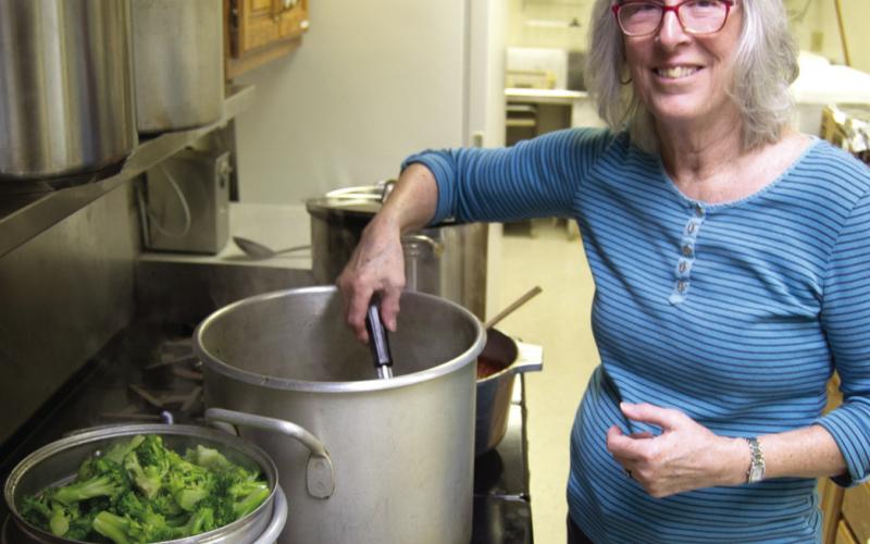 Ena Smittle was preparing the toppings, including steamed broccoli, for the PEO baked potato fundraiser Wednesday.