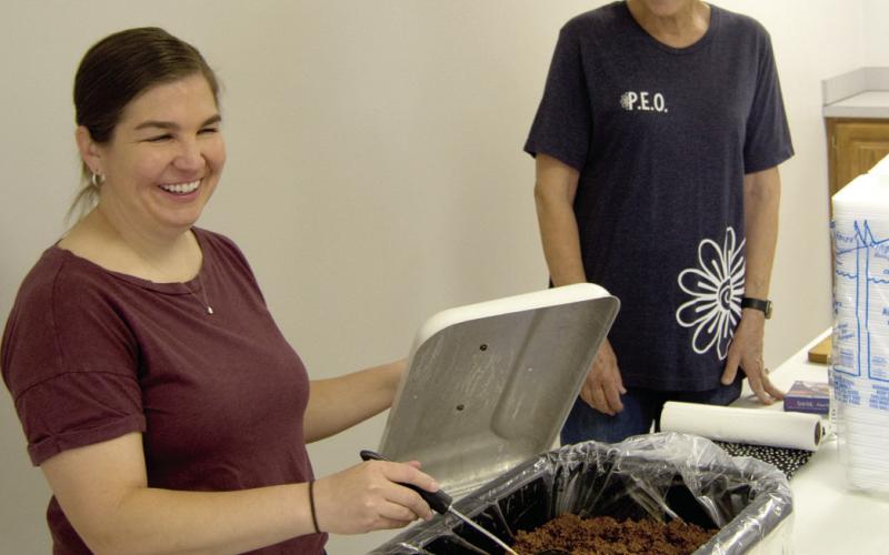 PEO members Sarah Kellenberge and Liza Kristian were working at the newly revived baked potato fundraiser Wednesday.