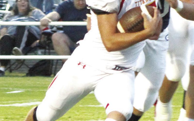 Titan Senior, Jaspen Tanner, runs around the end of the line and dives for the end zone to score the first Columbus touchdown of the night in Friday’s CNC League loss in Galena, 22-36. Tanner followed with the PAT kick and a 7-0, first quarter lead. Jaspen rushed ten times for 70 yards and was good on two of two PAT attempts.