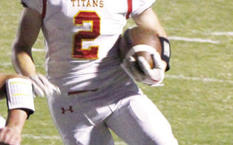 Junior, Luke Gray, picks up yardage for the Titans in the, 22-36, loss to the Bulldogs in Galena, Friday night. The Titans host Frontenac, Friday, for the annual homecoming game.