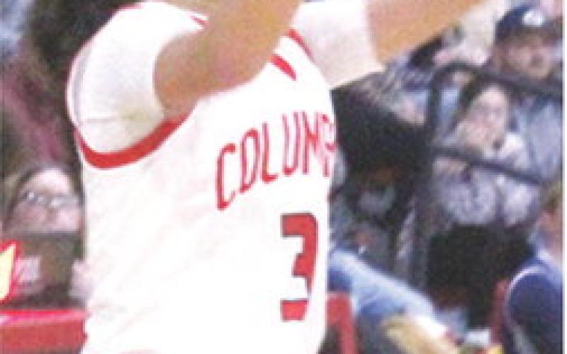 Lady Titan Senior, Brylie Johnson, takes a shot during the 42-35, Columbus win over Galena, Friday, at the CUHS Gymnasium. Brylie was a perfect five of five at the free throw line to add to her final tally of nine points. Complete coverage on Page 7.