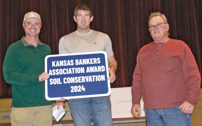 Kansas Bankers Association Key Banker Jim Gaither presented the Cherokee County Kansas Bankers Conservation Award to Crey Brake for his conservation efforts on his farm south of McCune. The award was presented during the County Conservation Dinner on Monday evening.