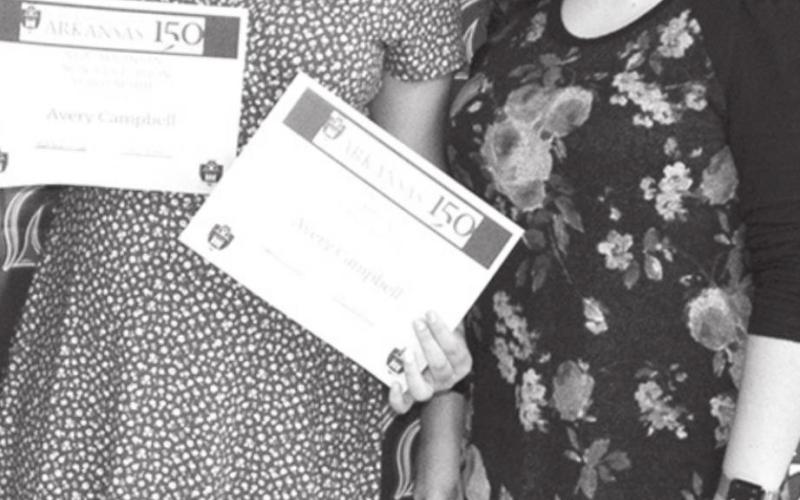 Laura Boeckman, CUHS Instructor, presented Avery with two scholarships from the University of Arkansas.