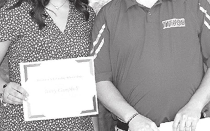 Michael Sauerwein, CUHS Business Instructor, presented Avery with the Business Scholarship.