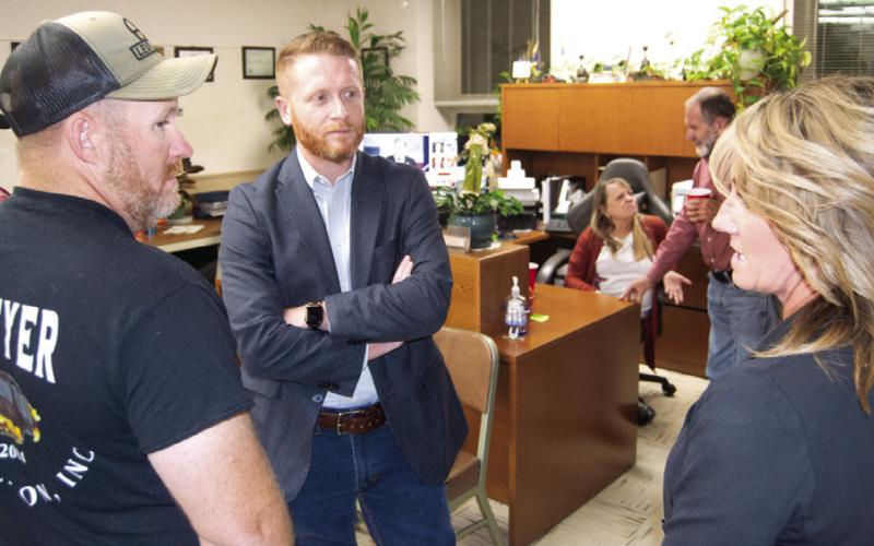 While waiting for election results, Cory Moates talks with Jacob Conard and Lorie Johnson at the Republican watch party. Karen Johnston, newly elected Register of Deeds, was congratulated by Barbara Bilke. Bilke is retiring from the Register of Deeds position. Johnston has worked in the office for a number of years and is familiar with the functions of the office.