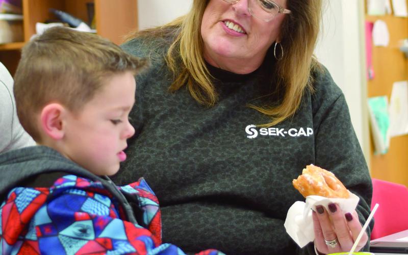 Maddox Grant enjoyed a visit with Jamie Ball at Park Elementary recently for their Books and Breakfast event. Friends, family members and older students read a book or two and had breakfast at the event. Courtesy photo.