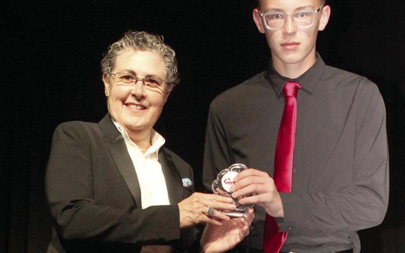 Awards were presented to Columbus High School instrumental musicians at the end of year concert. Gae Phillips, band director, presented Cooper Grundy with the Most Improved Award.