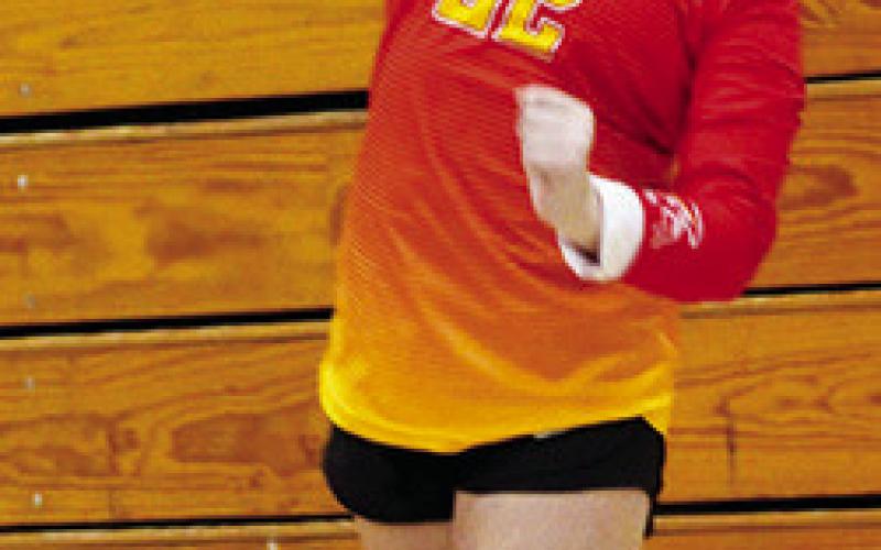 Lady Titan Eighth Grader, Landrey Perry, serves for Columbus in recent matches at the CUHS Gymnasium. The Lady Titans ended their season yesterday in the CCCJL Tournament in Frontenac.