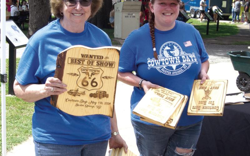 Plaques for the Car Show Winners were distributed Saturday. The unique burned wood plaques were popular among the drivers. Chamber Board Members Jessica Moore and Debbie Hopkins were preparing the plaques for presentation.