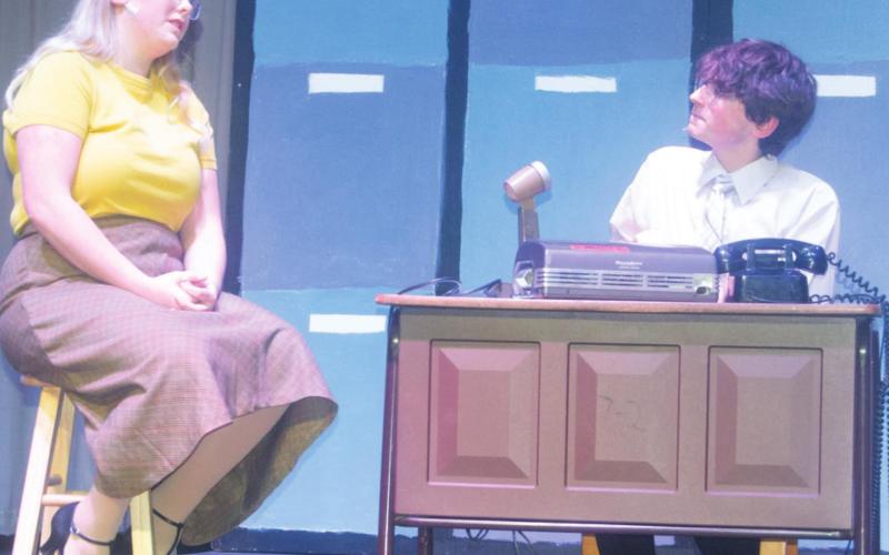 The musical comedy “Pajama Game” will be performed at CUHS over the weekend. Students Hannah Daniels as “Babe” Williams and John Smith as Sid Sorokin perform a scene together near the end of the first act. Photo by Jacob Spencer.