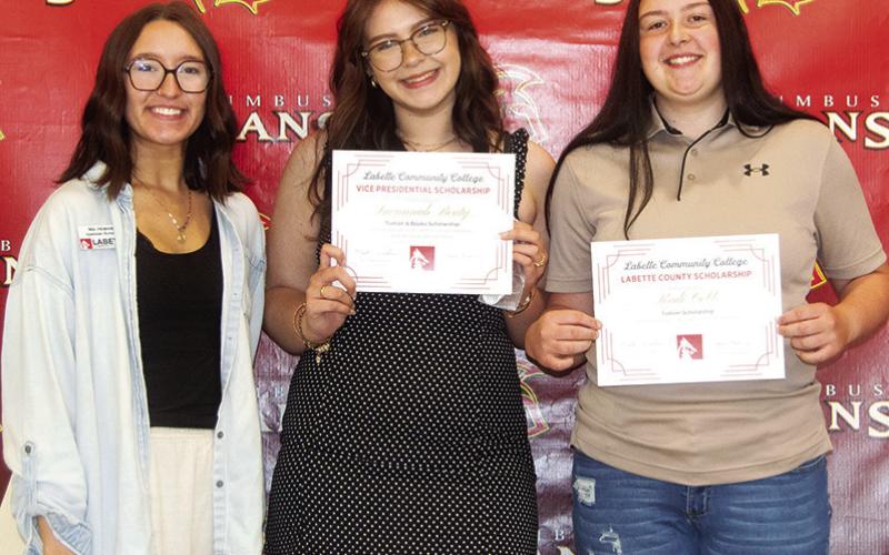 Savannah Beaty received a Cardinal Scholarship for $300 and the Cardinal Academic Scholarship in the amount of $4,176 from Labette County Community College during the Senior Assembly, May 16, at the CUHS Gym. Kadi Cobb received a Labette County Scholarship for $3,904. The scholarships were presented by Mia Howard, LCC Representative .