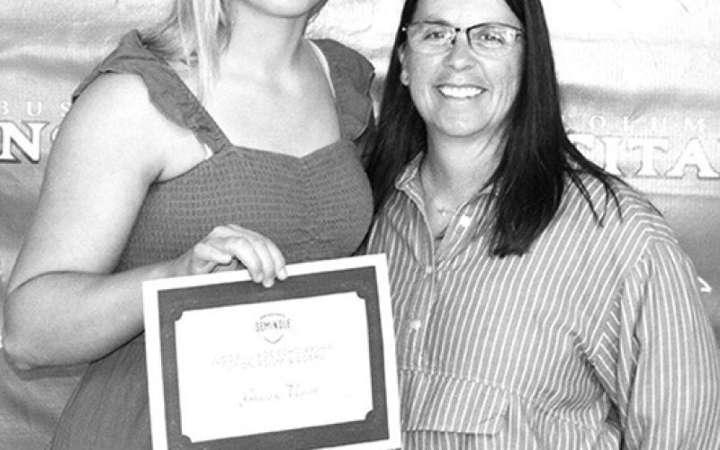 Lady Titan Senior, Graci Major received a $20,800 Softball Scholarship from Seminole State College for tuition, room, and board from former Lady Titan Softball Head Coach Aimee Saporito during the Senior Awards Ceremony at the CUHS Gymnasium, May 17.