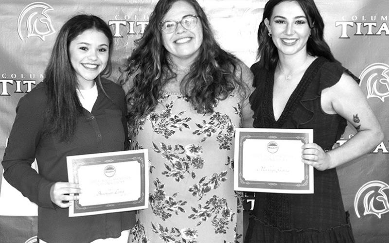 Columbus Unified High School Seniors Brooklyn Lima and Madelyn Garcia received $6,000 scholarships from Barton County Community College to cheer at the college level. CUHS Cheer Sponsor, Misty Smith, presented the scholarships during the Senior Awards Ceremony, May 17, at the CUHS Gymnasium.