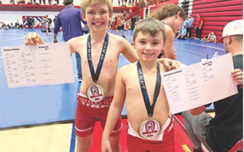 Columbus Titan Mini Wrestlers Lucas Natalini and Barrett Bowin took first place at the Seneca, Mo. Wrestling Tournament, Sunday. Courtesy photo.