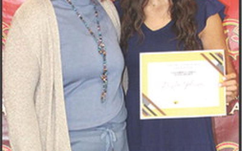 Brylie Johnson received the Columbus Cares Columbus Community Foundation Scholarship in the amount of $500 at the Senior Assembly, May 16, in the Columbus Unified High School Gymnasium. The presentation was made by Kelly Walters, USD 493 Title 1 Reading Specialist.