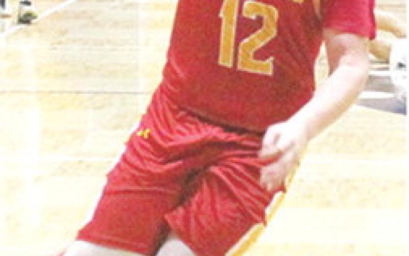 Titan Junior, Ethan Midgett, gets a steal late in the fourth quarter and drives to the basket to help seal the road win for Columbus in Galena, 48-36, Friday.