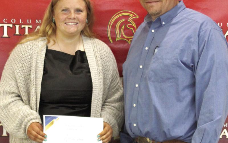 Madisen Rand received the MFA and National FFA, Scholarships for $5,000 from Columbus High School FFA Advisor, KC Youngblood, during the 2025 Senior Assembly, May 16, at the CUHS Gymnasium.