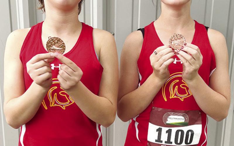 Hieyla Shelton placed tenth and Cora Rider was seventh for the Columbus Junior High Cross Country Team in the two mile, seventh grade, race at Humboldt, Tuesday. Courtesy photo.