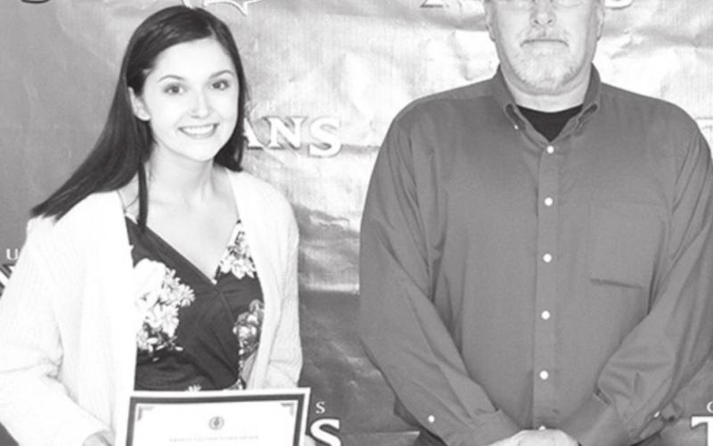 Hannah Andrews received the Ernie Vaughn Scholarship in the amount of $250 from CUHS Math Teacher, Ernie Vaughn at the Senior Awards Assembly in the CUHS Gymnasium, May 14.