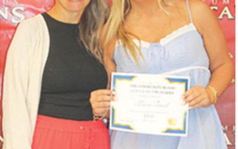 Macee Troxell, senior, received the $300 Community Blood Center of the Ozarks Scholarship from USD 493 Instructor, Brand Pierce, during the 2026 Senior Assembly, May 15, at the Columbus Unified High School Gymnasium.