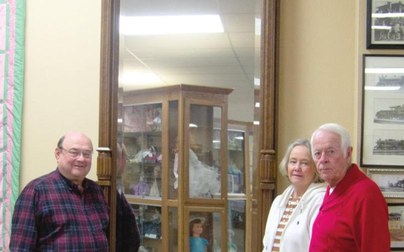 Wes and Jan Houser donated an 11-foot tall, 182 year old mirror to the Columbus Museum last week. Ron Holmes was present to formally accept the donation March 11. Photo by Jacob Spencer.