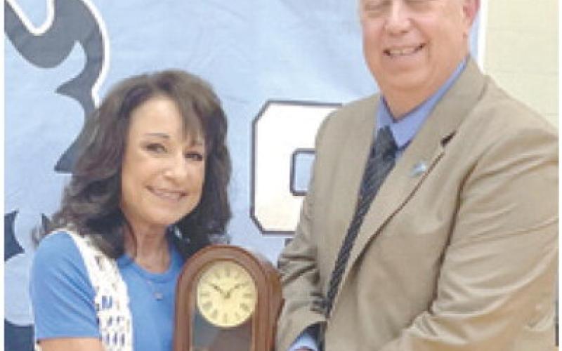 Brenda Waugh was recognized on her retirement from USD247 after 37 years. Dr. Brad Miner presented her award. Courtesy photos.