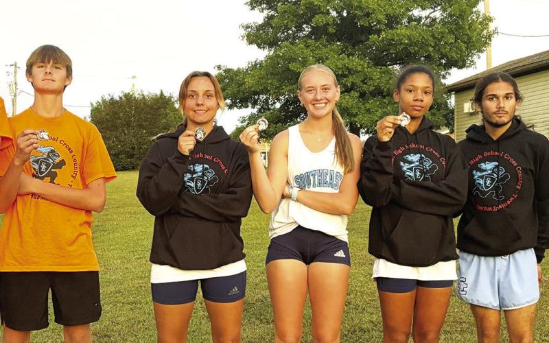 Zayne Gabern, Tucker Sutton, Jackie Robinson, Kendyl Renn, Journee Rimmer, Zack Whittenburg, and Michael Smith were the individual medalists for the Southeast Lancers in their home cross country meet, Thursday, at the Weir Baptist Church Camp. The Lancer Varsity Boys Team placed second in the team standings. See complete results on page nine of today’s News-Report. Courtesy photo.