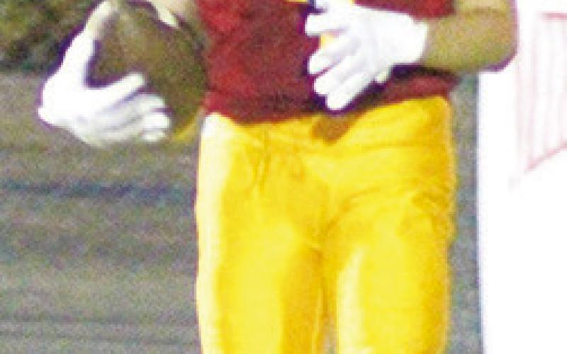 Eighth Grader, Braun Stone, gains yardage for the Titans in their 8-38, loss to Parsons, Thursday, at Titan Stadium. Matt Webb, Titan Seventh Grader, came down in the end zone with an 11-yard pass from Cole Howard for six points in the seventh grade shut out of the Vikings, 32-0, Thursday.