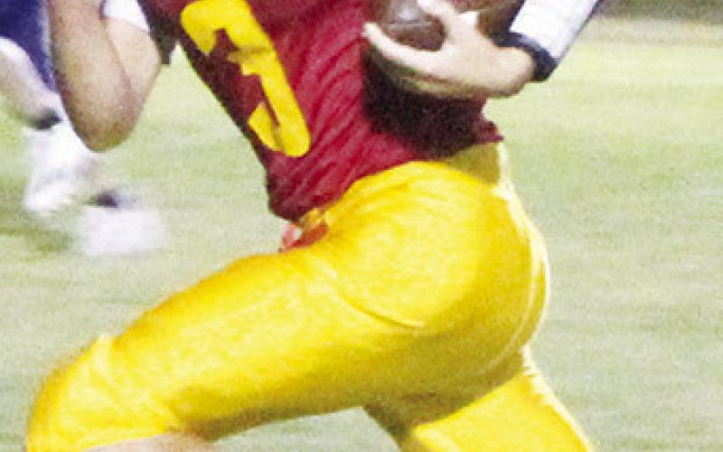 Columbus Titan Eighth Grader, Carter Woodcock and seventh grader, Cole Howard, dash for touchdowns in their respective games with Parsons, Thursday, at Titan Stadium. The eighth grade squad lost to the Vikings, 38-8, while the seventh graders shut out their visitors, 32-0, in the night cap.